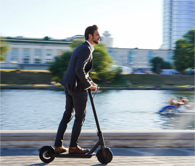 man riding a Escooter