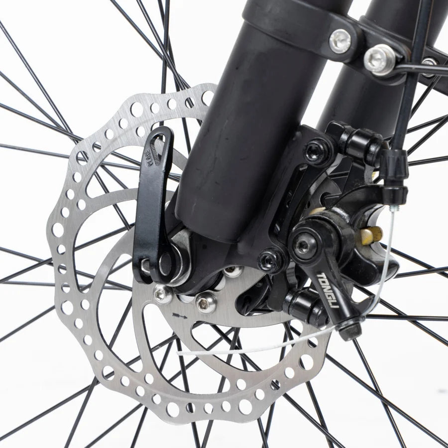 Close-up of a bicycle disc brake system with a white background