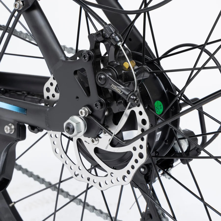 Close-up of a bicycle's disc brake system on a white background